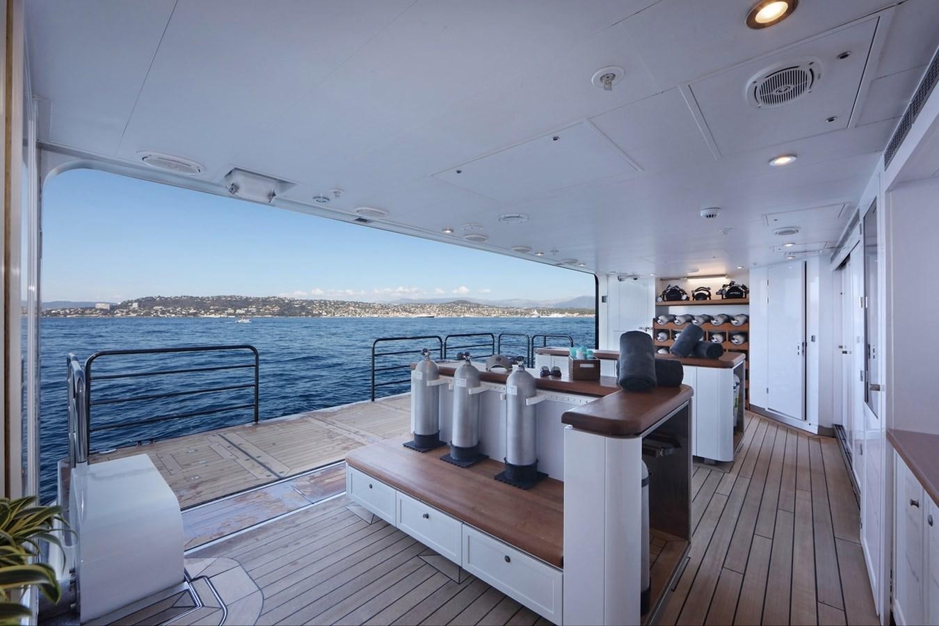 a large white boat on a dock aboard OCTOPUS Yacht for Sale