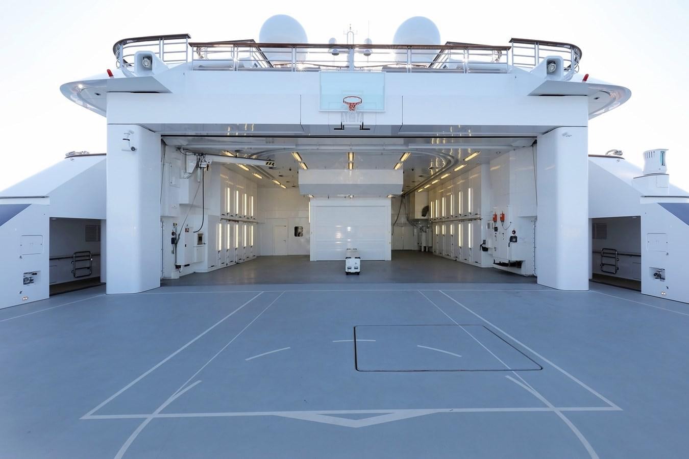 a large white building with a blue floor aboard OCTOPUS Yacht for Sale