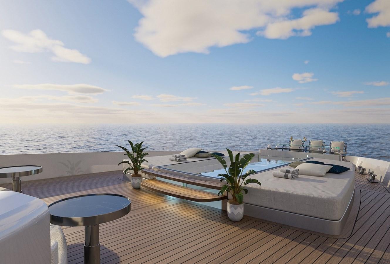 a balcony with a table and chairs aboard NIGHT FURY II Yacht for Sale