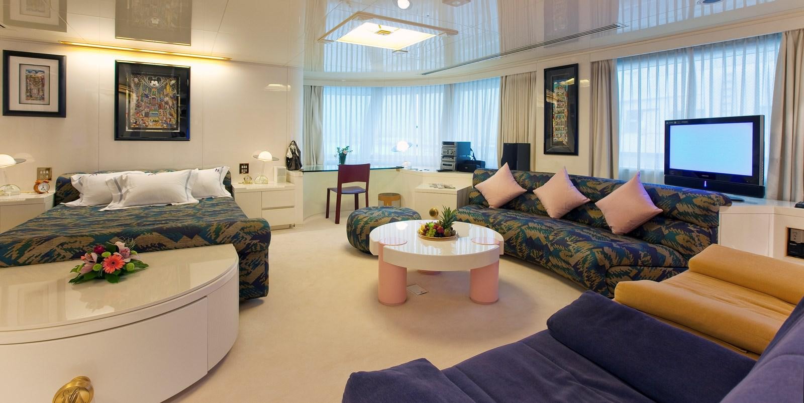 a room with a bed and a tv aboard LADY MOURA Yacht for Sale