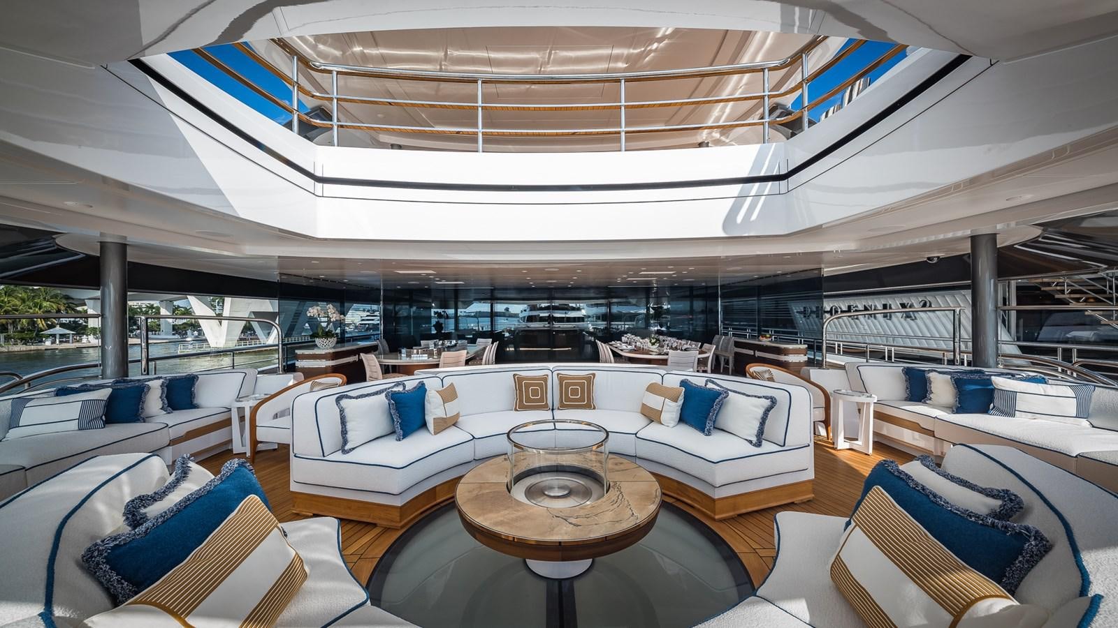 a large lounge area with a table and chairs aboard CC-SUMMER Yacht for Sale