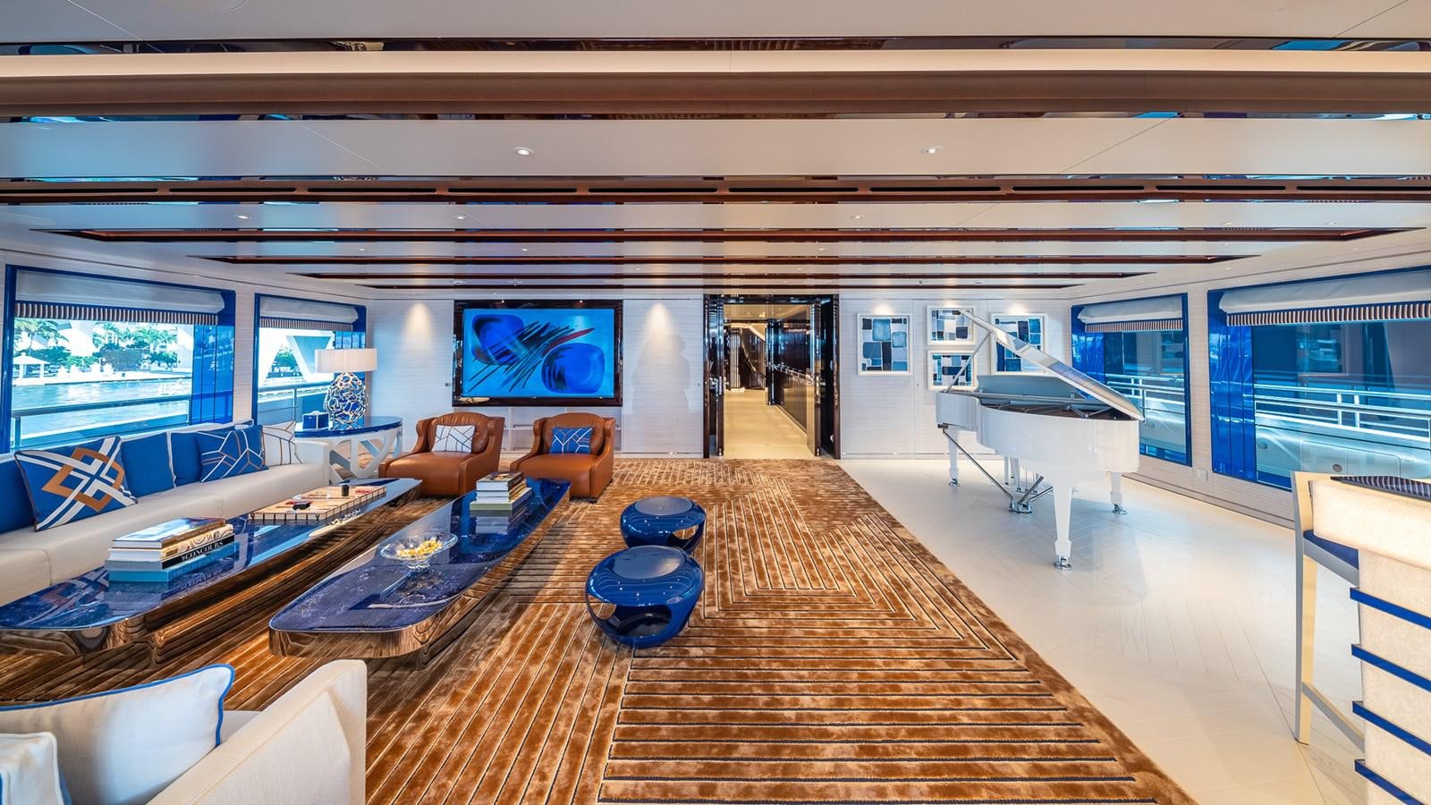 a large living room with a large wood floor aboard CC-SUMMER Yacht for Sale