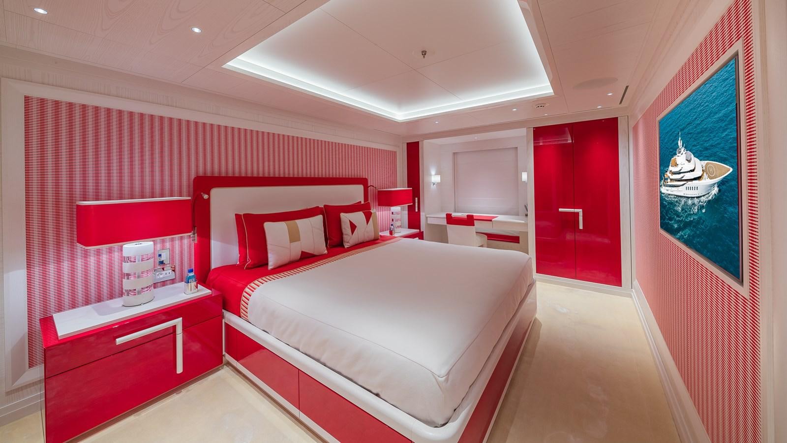 a room with a bed and a mirror aboard CC-SUMMER Yacht for Sale