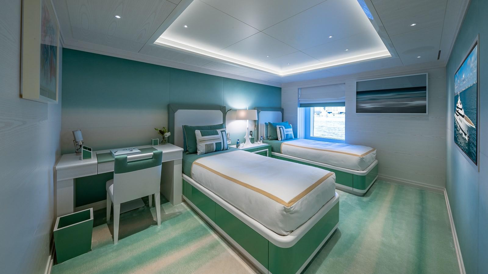 a room with beds and desks aboard CC-SUMMER Yacht for Sale