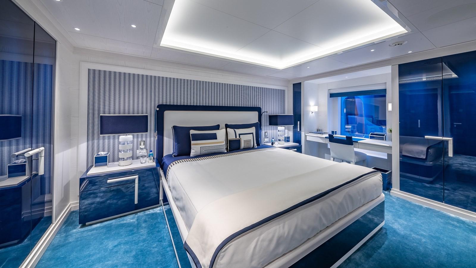 a room with a bed and a desk aboard CC-SUMMER Yacht for Sale