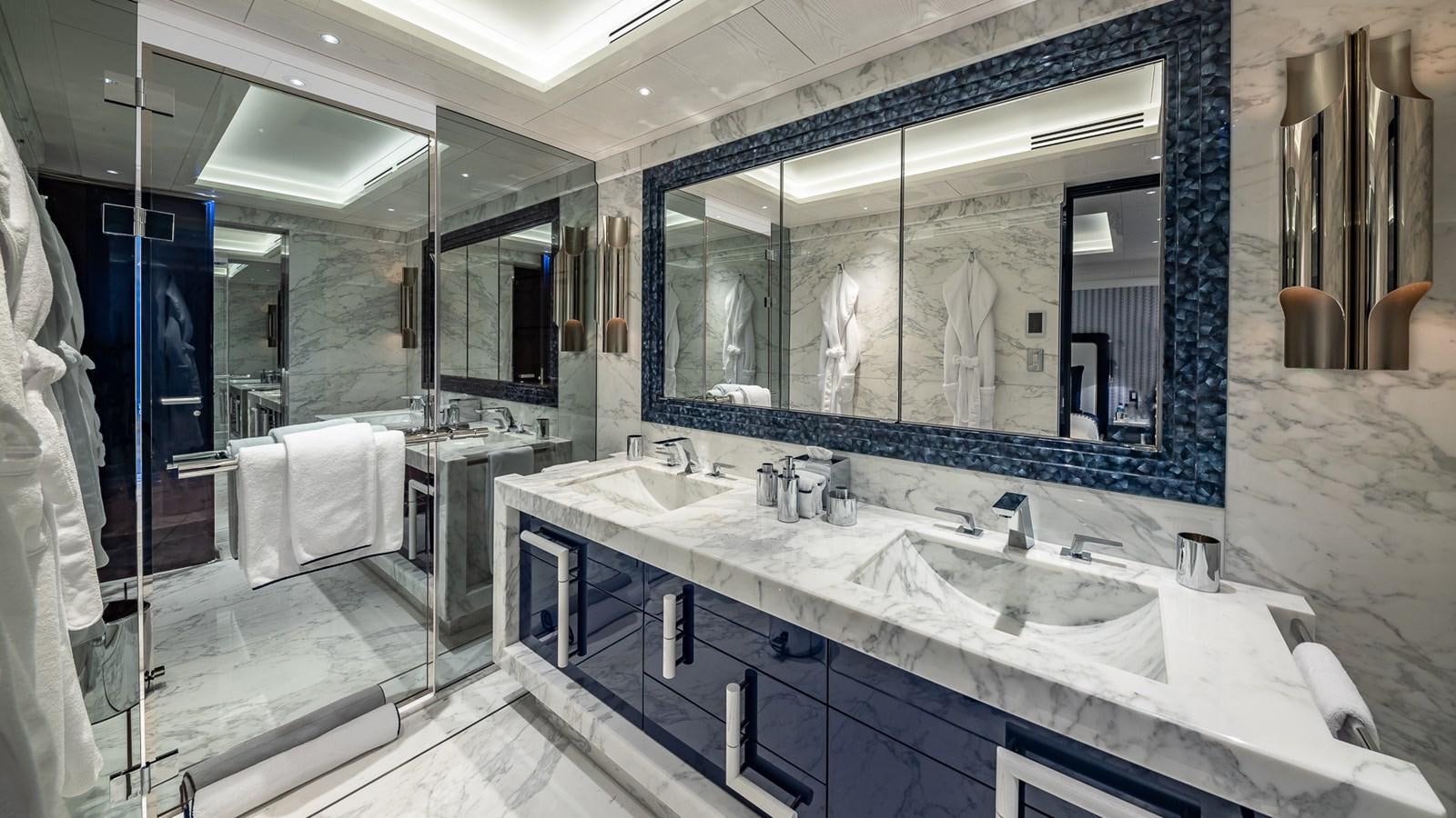a bathroom with a large mirror aboard CC-SUMMER Yacht for Sale