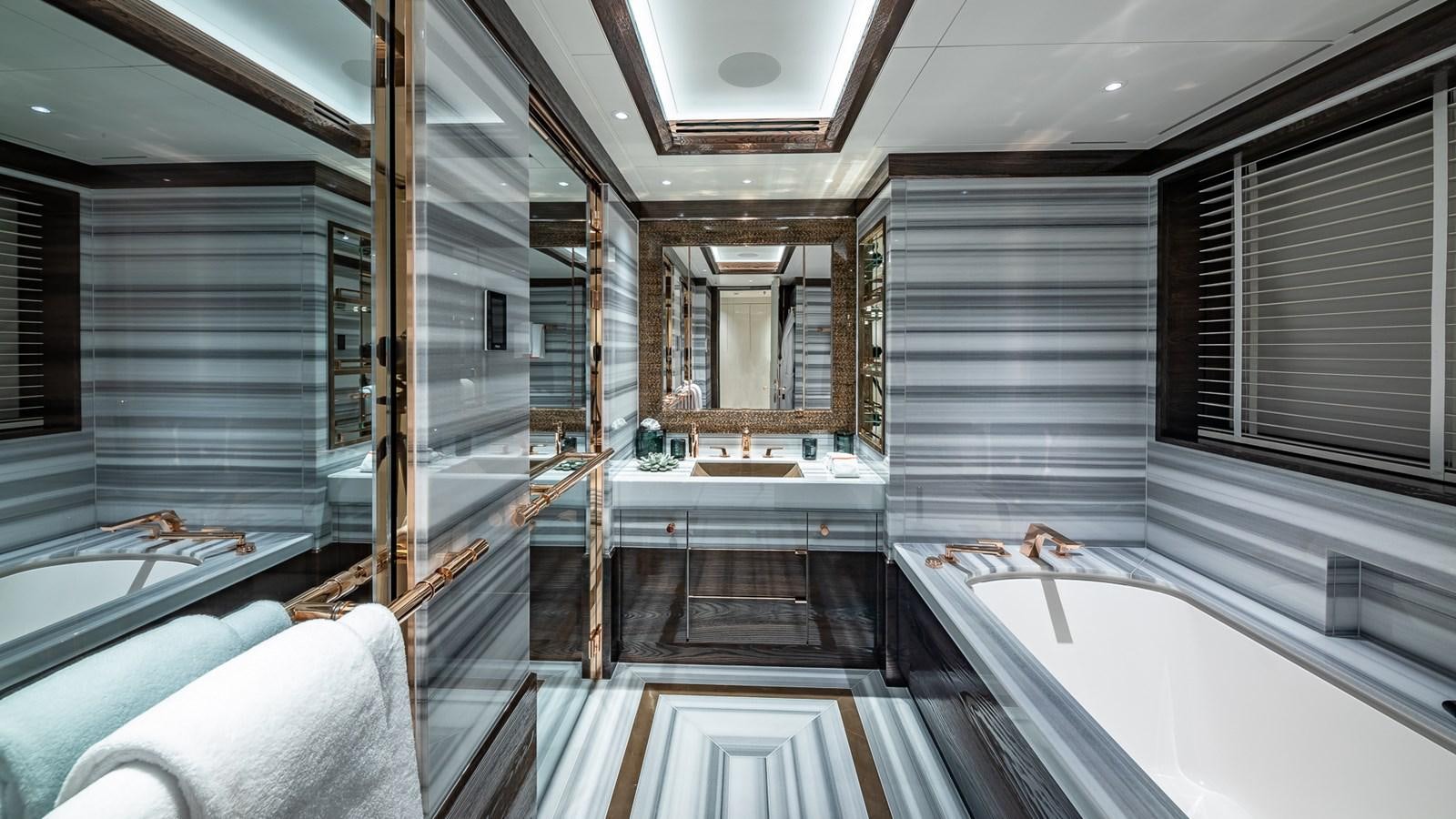 a bathroom with a tub sink and a shower unit aboard CC-SUMMER Yacht for Sale