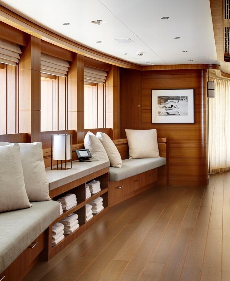 a living room with a couch and a coffee table aboard MAN OF STEEL Yacht for Sale