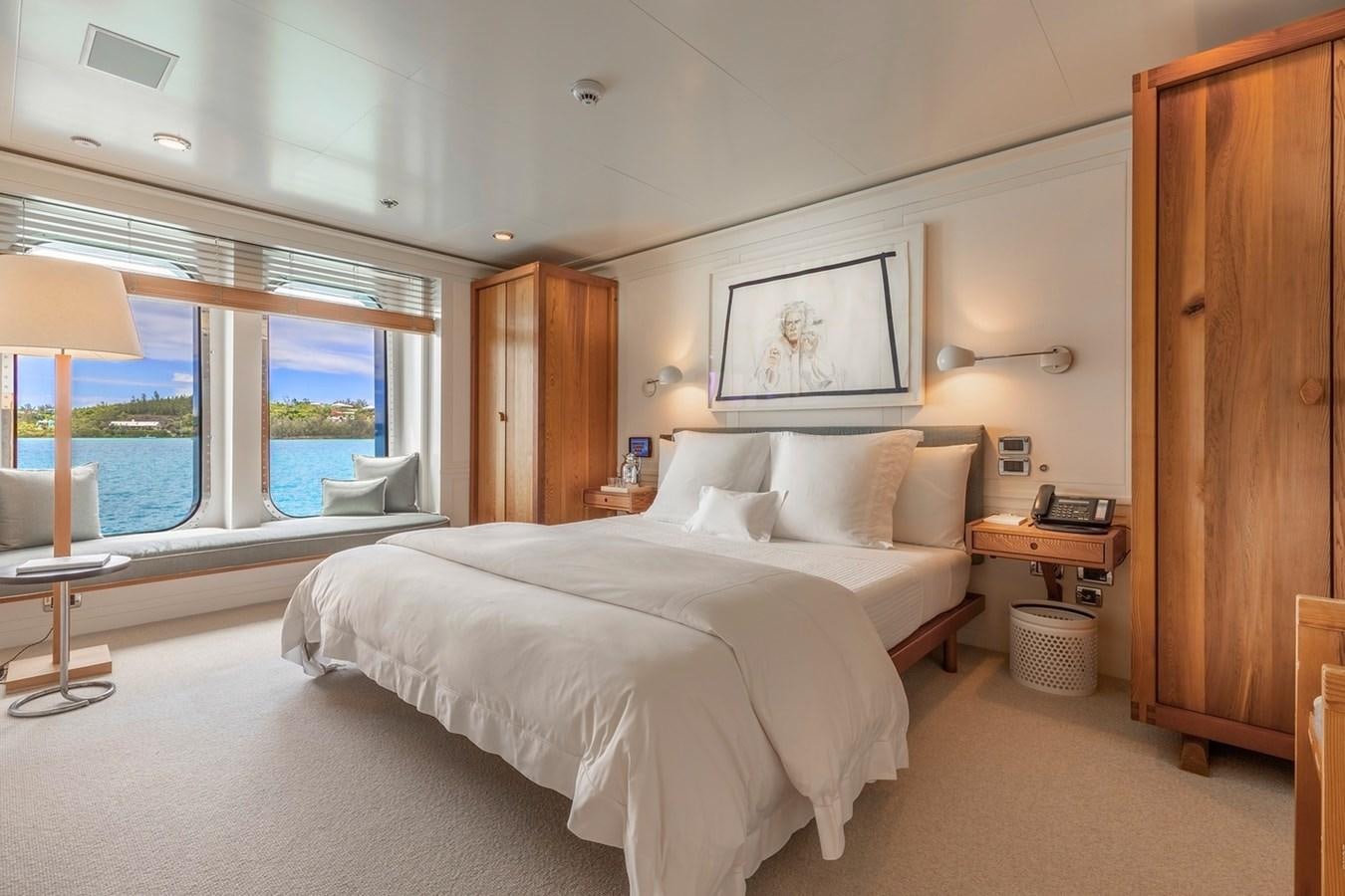 a large bedroom with a large bed aboard HBC Yacht for Charter