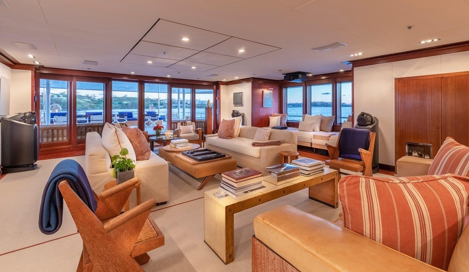 a living room with a large window aboard HBC Yacht for Charter