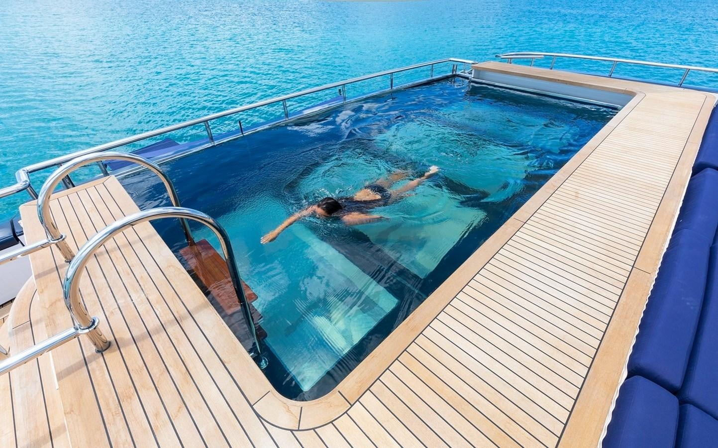 a person swimming in a pool aboard HBC Yacht for Charter
