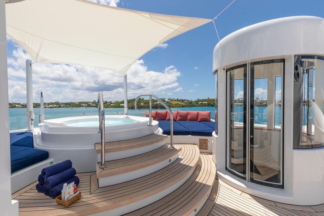 a room with a large white tent and a pool aboard HBC Yacht for Charter