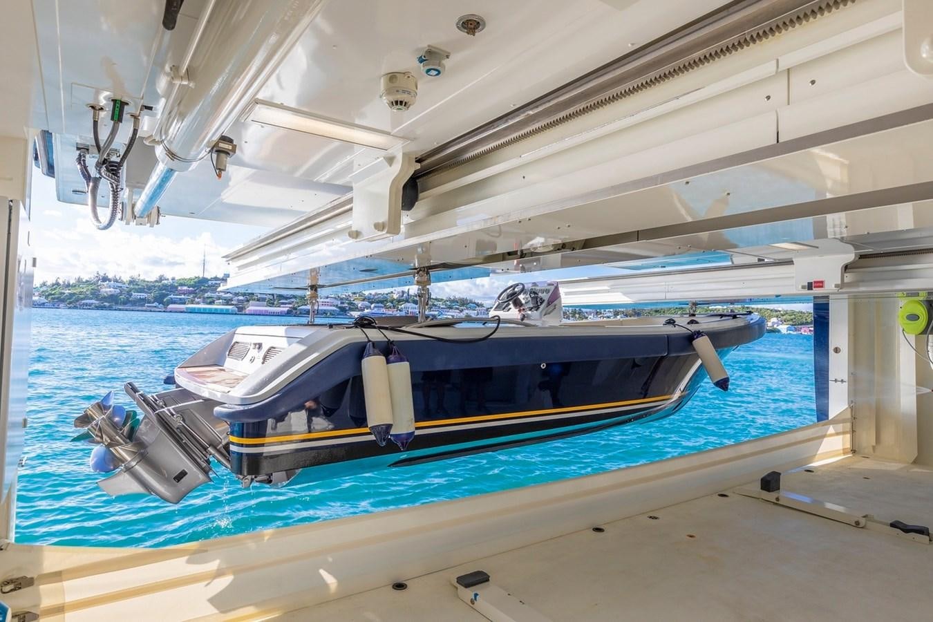 a boat under a bridge aboard HBC Yacht for Charter
