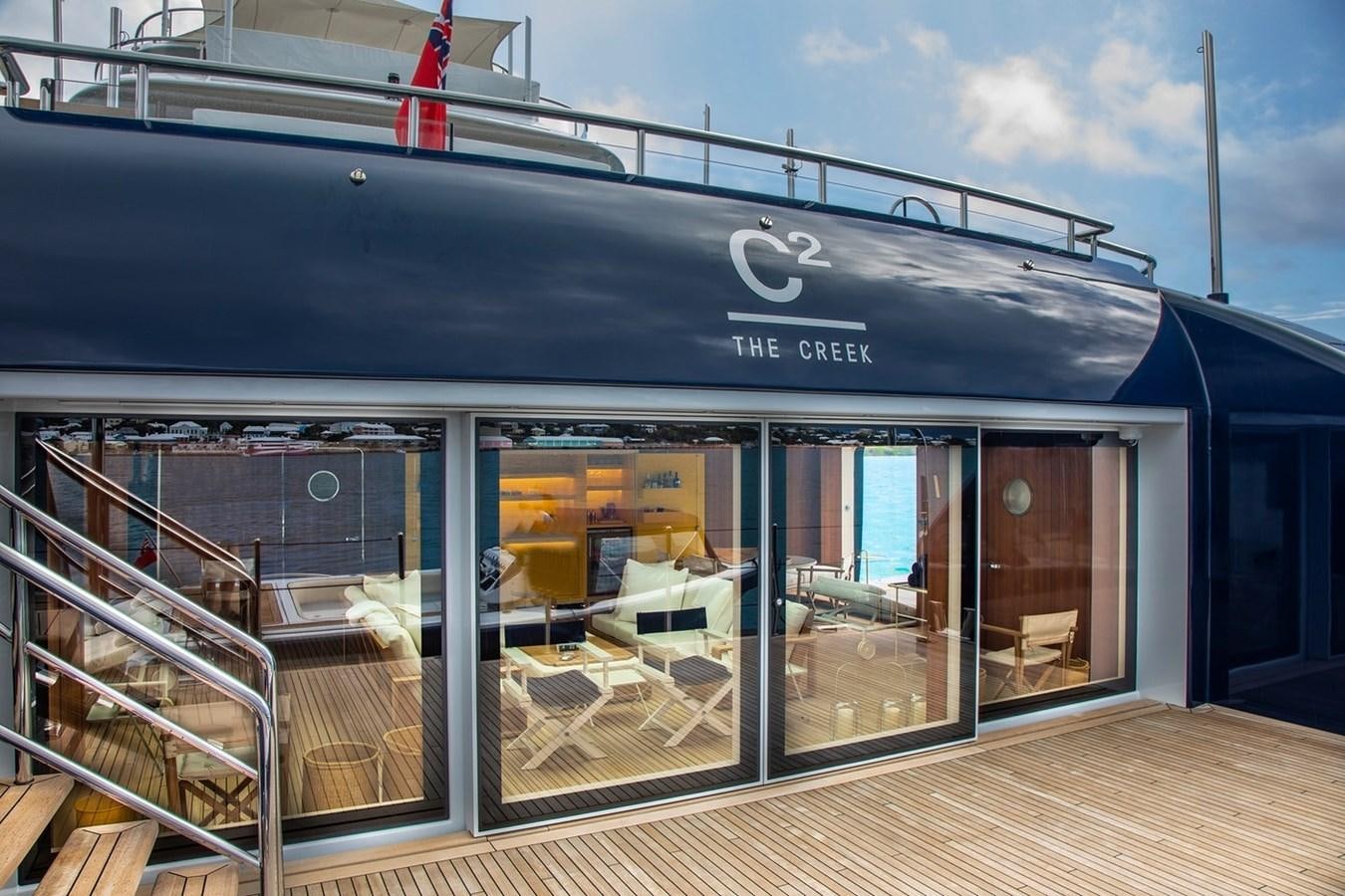 a large glass building with a glass front aboard HBC Yacht for Charter