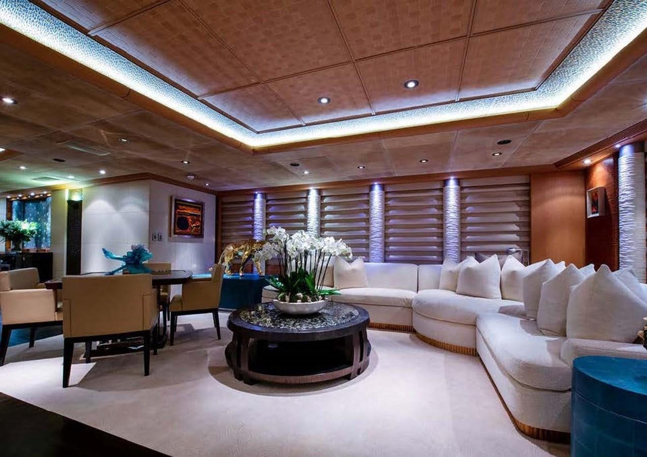 a large room with a table and chairs aboard SUNRAYS Yacht for Sale