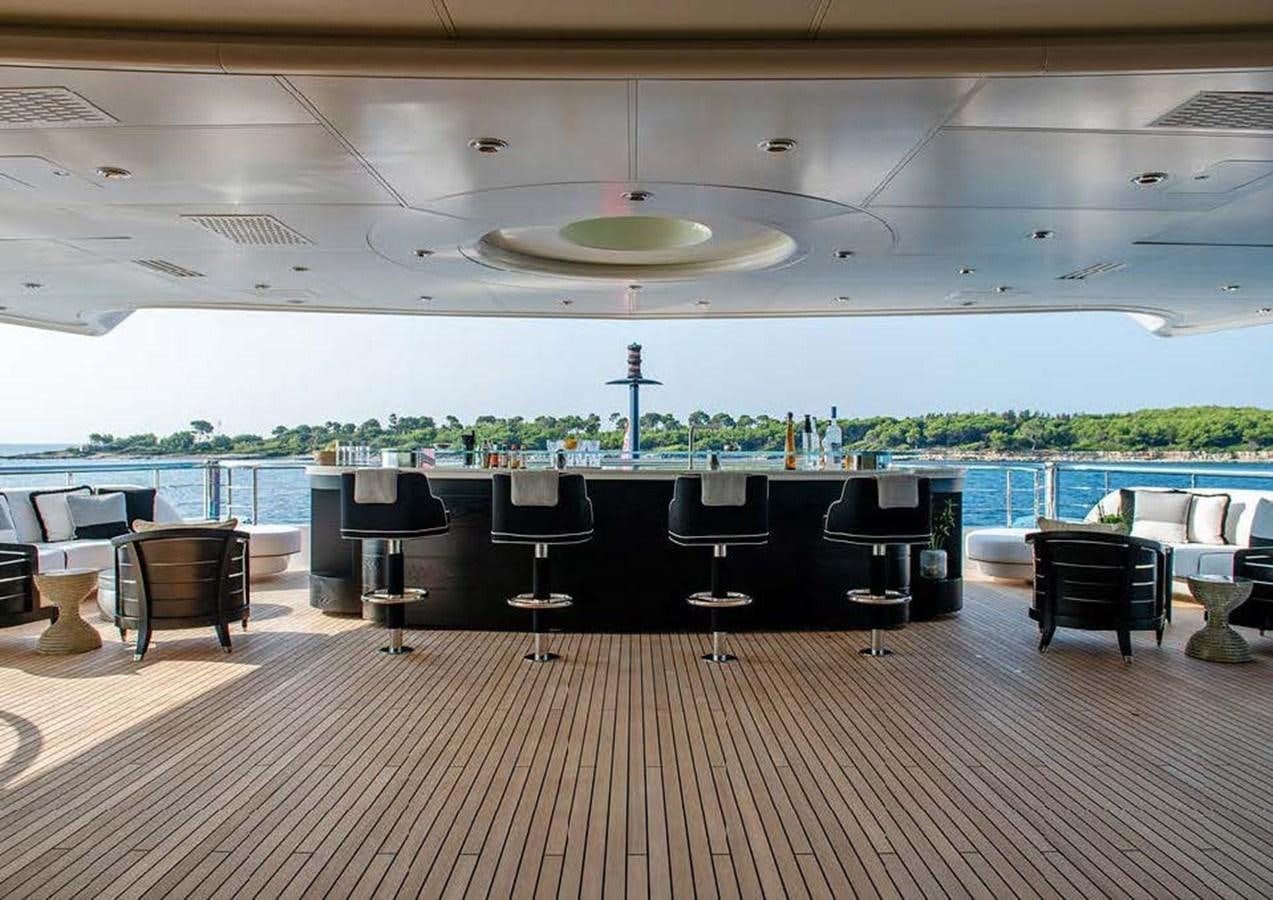 a room with a table and chairs aboard SUNRAYS Yacht for Sale