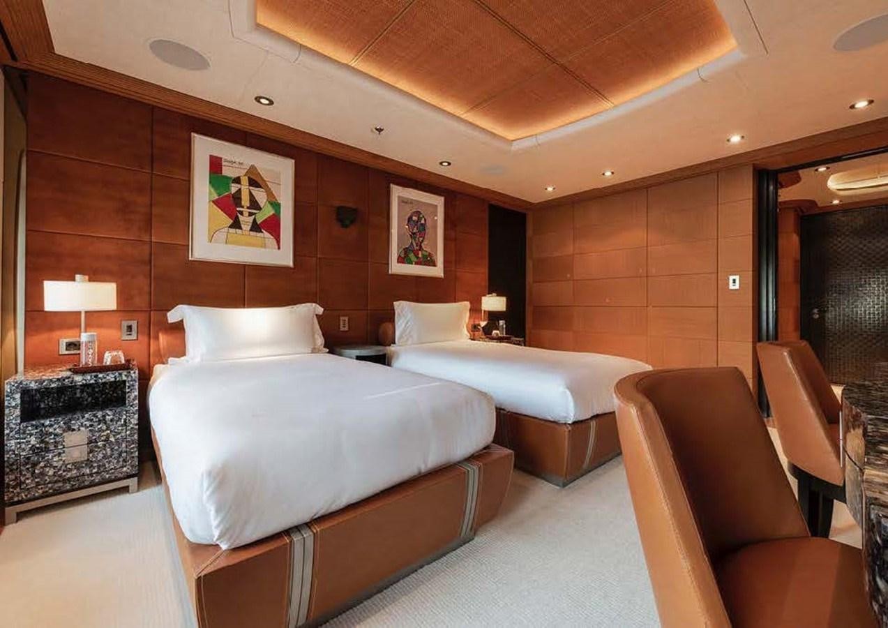 a hotel room with two beds aboard SUNRAYS Yacht for Sale