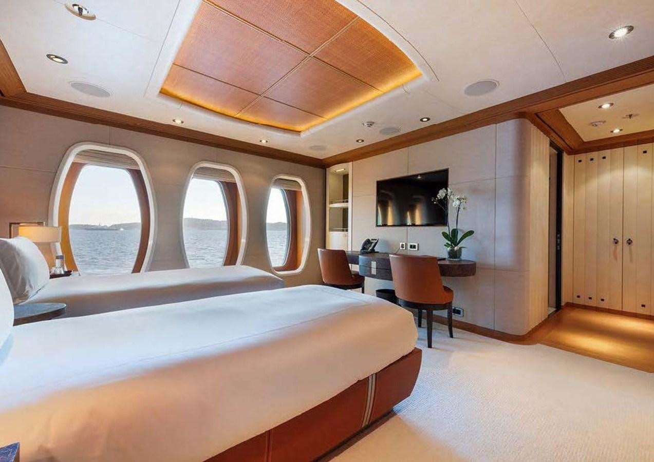 a room with a bed and a chair aboard SUNRAYS Yacht for Sale