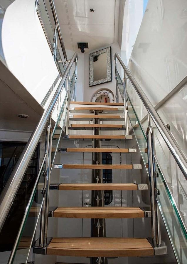 a set of wooden stairs aboard SUNRAYS Yacht for Sale