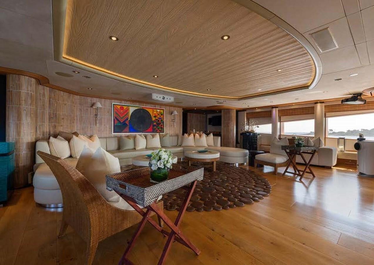 a large living room with a large table and chairs aboard SUNRAYS Yacht for Sale
