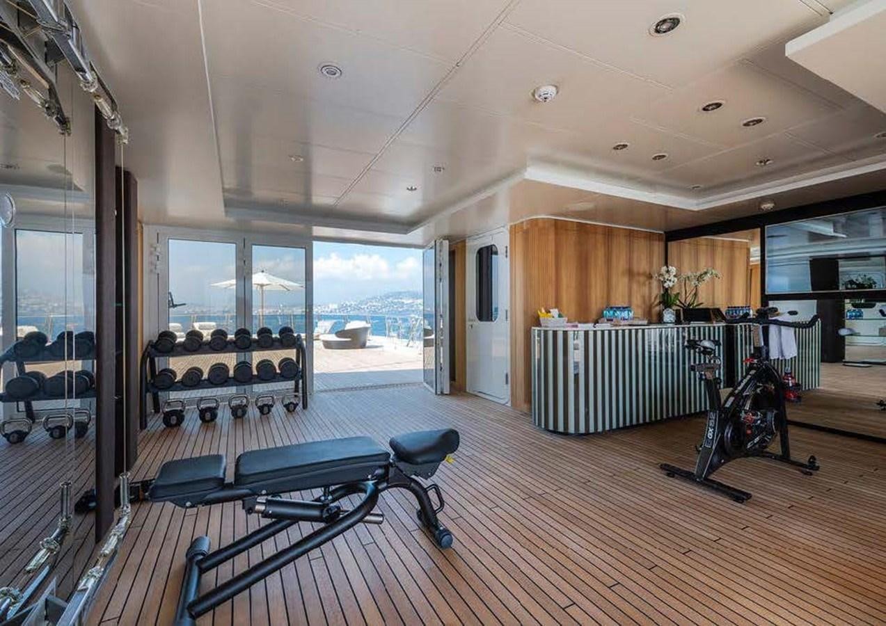 a room with a table and chairs aboard SUNRAYS Yacht for Sale