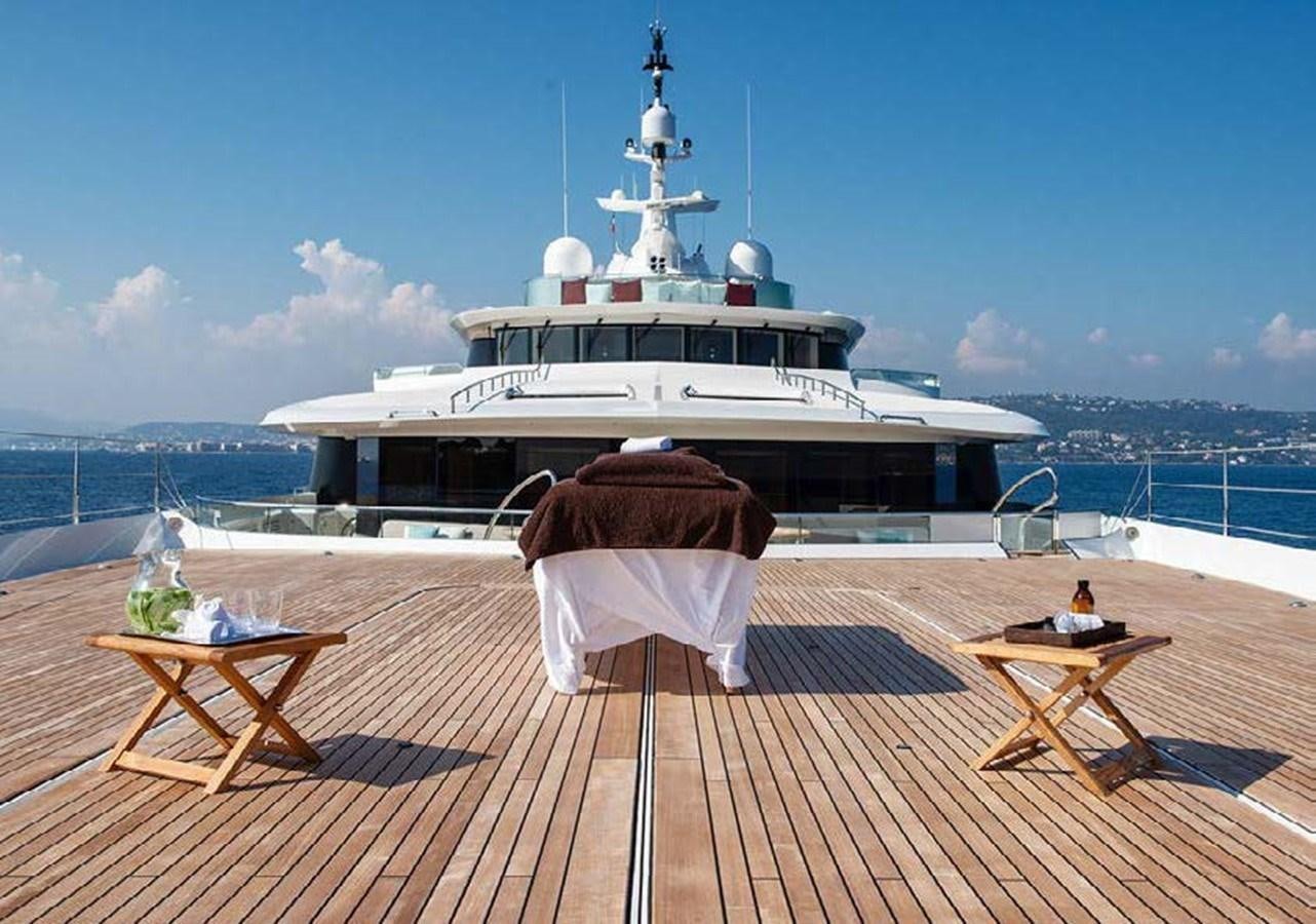 a large ship docked at a pier aboard SUNRAYS Yacht for Sale