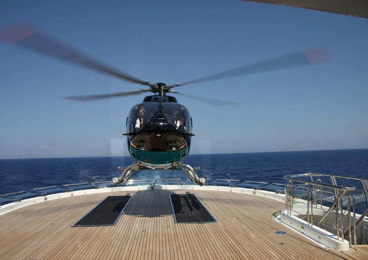a helicopter on a deck aboard SUNRAYS Yacht for Sale