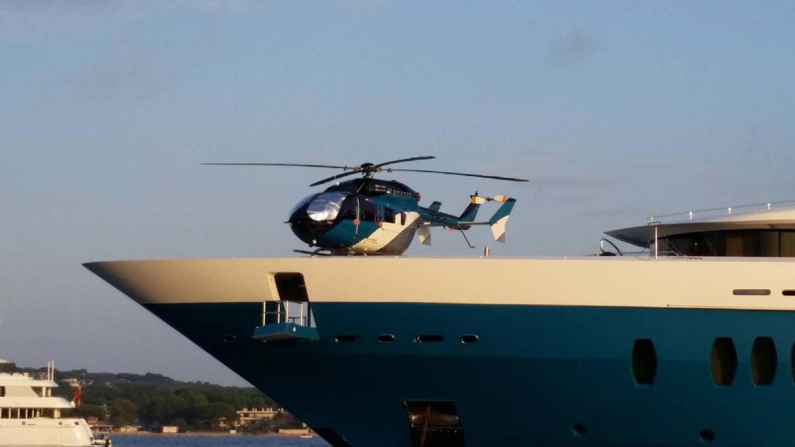 a helicopter flying over a boat aboard SUNRAYS Yacht for Sale