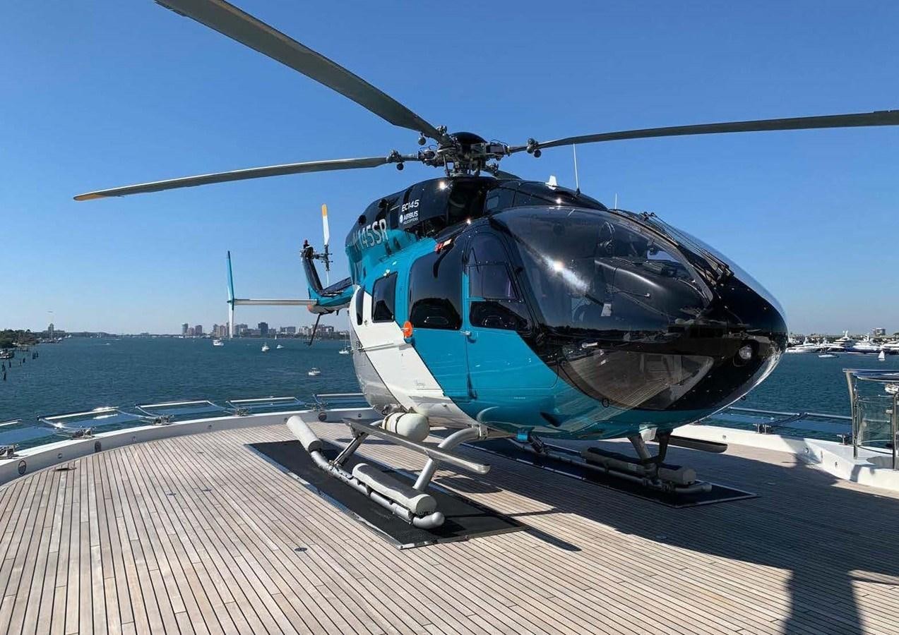 a helicopter on a deck aboard SUNRAYS Yacht for Sale