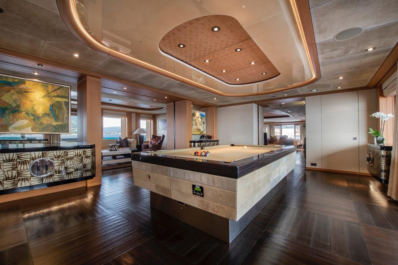 a large room with a large table and chairs aboard SUNRAYS Yacht for Charter