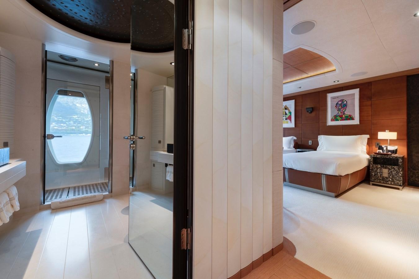 a bedroom with a bed and a mirror aboard SUNRAYS Yacht for Sale