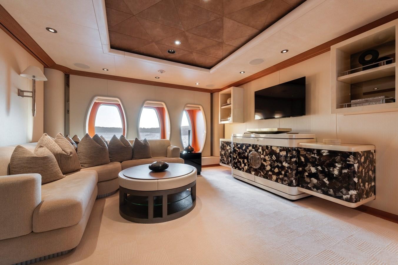 a living room with a large fireplace aboard SUNRAYS Yacht for Charter