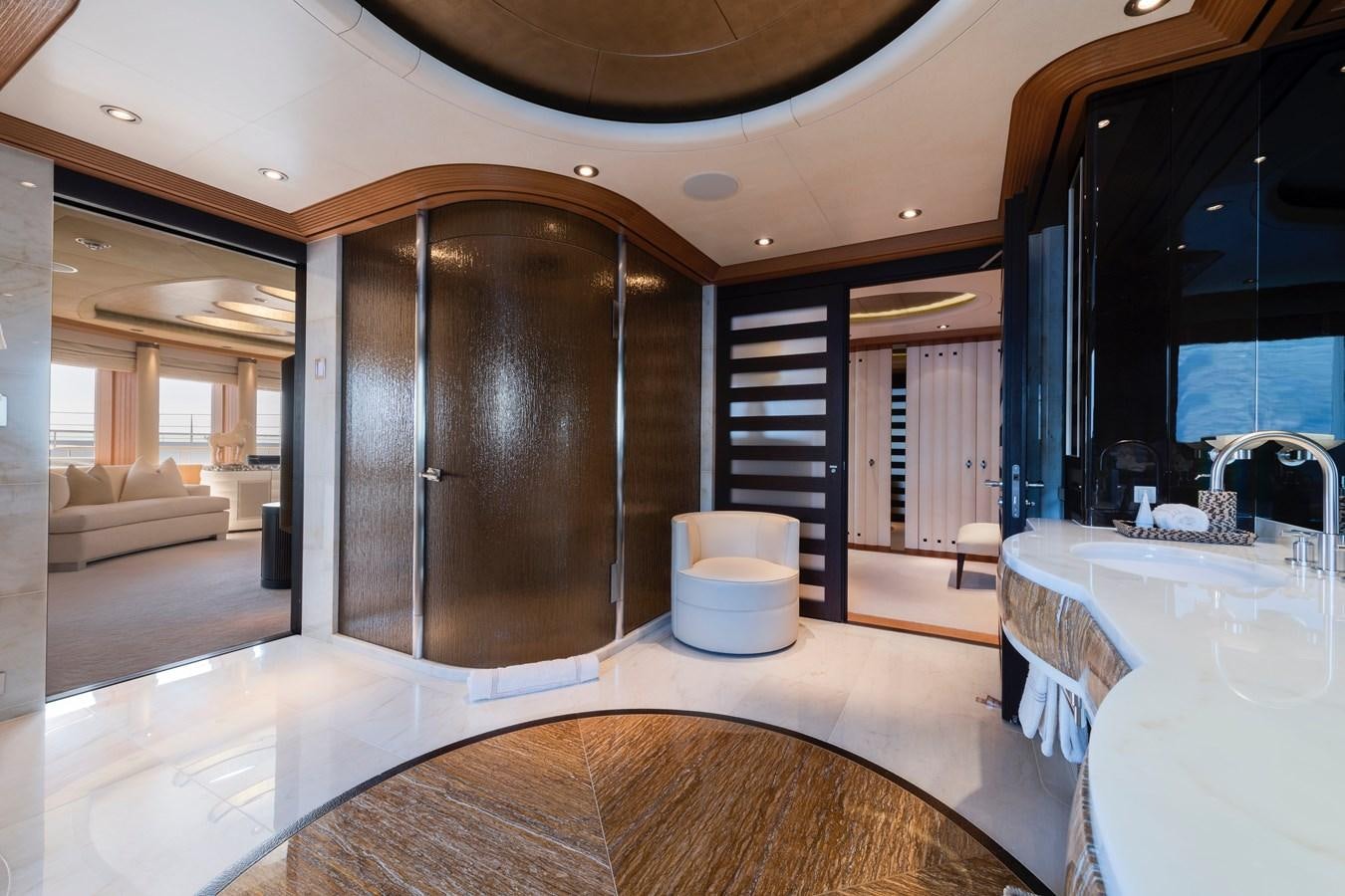 a large living room with a large glass door aboard SUNRAYS Yacht for Sale