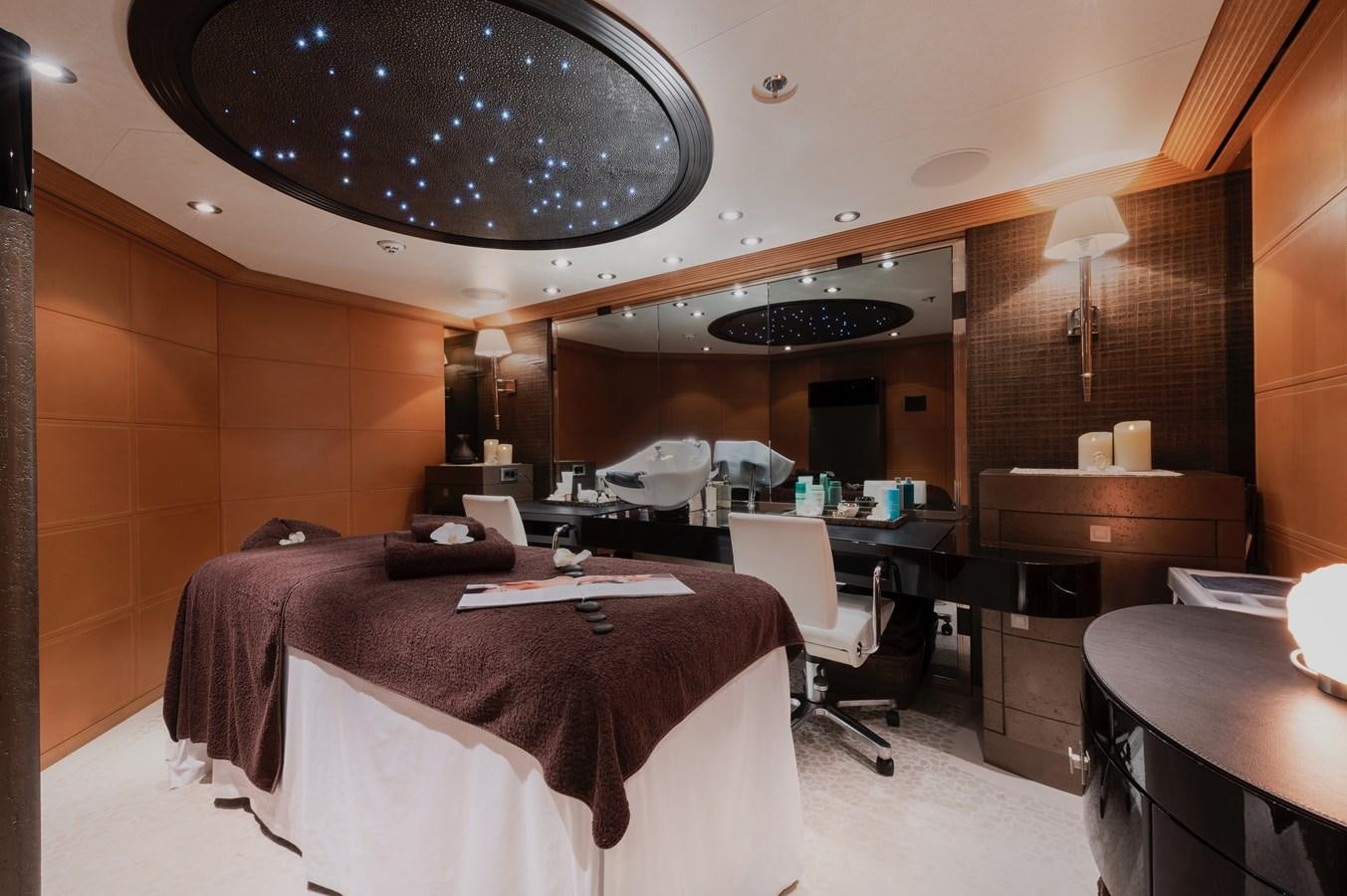 a room with a bed and desk aboard SUNRAYS Yacht for Sale