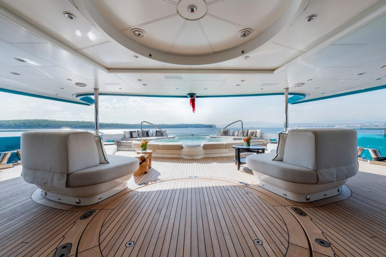 a room with a couch and a table and a chair aboard SUNRAYS Yacht for Sale