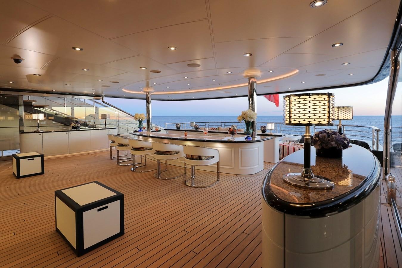 a room with a table and chairs aboard EYE Yacht for Sale