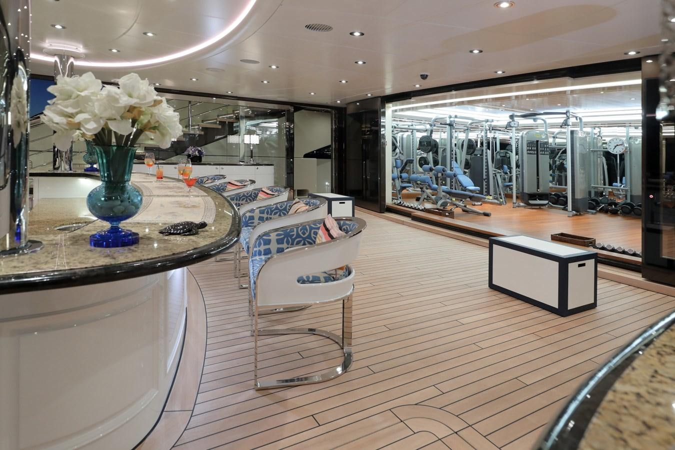 a room with a table and chairs aboard EYE Yacht for Sale