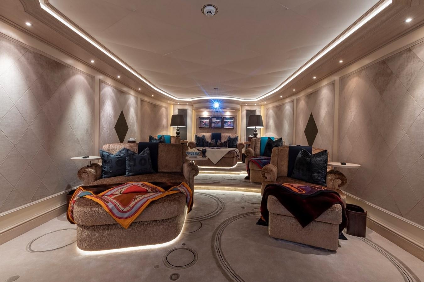 a living room with a couch and a tv aboard EYE Yacht for Sale