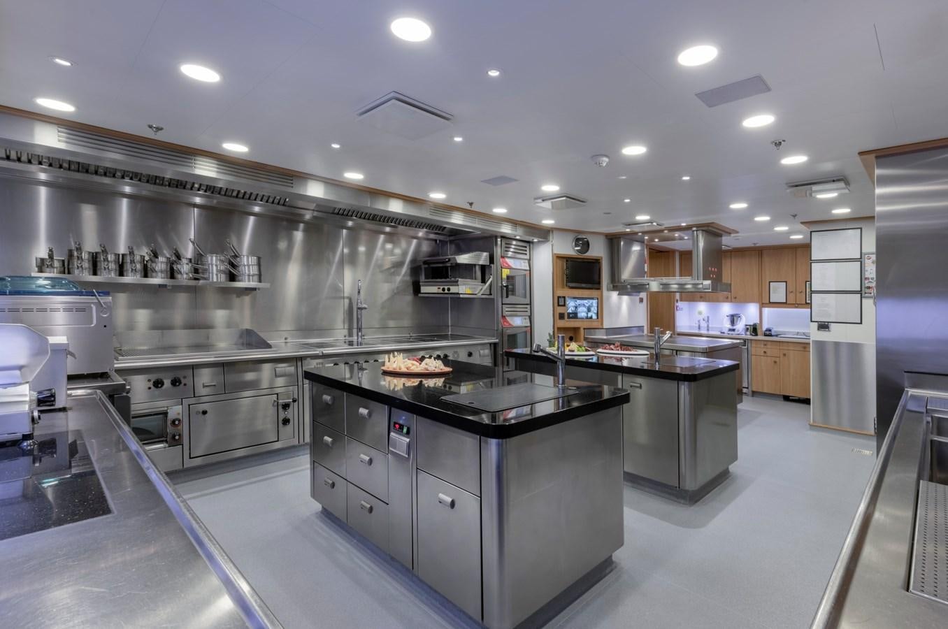 a kitchen with stainless steel appliances aboard EYE Yacht for Sale