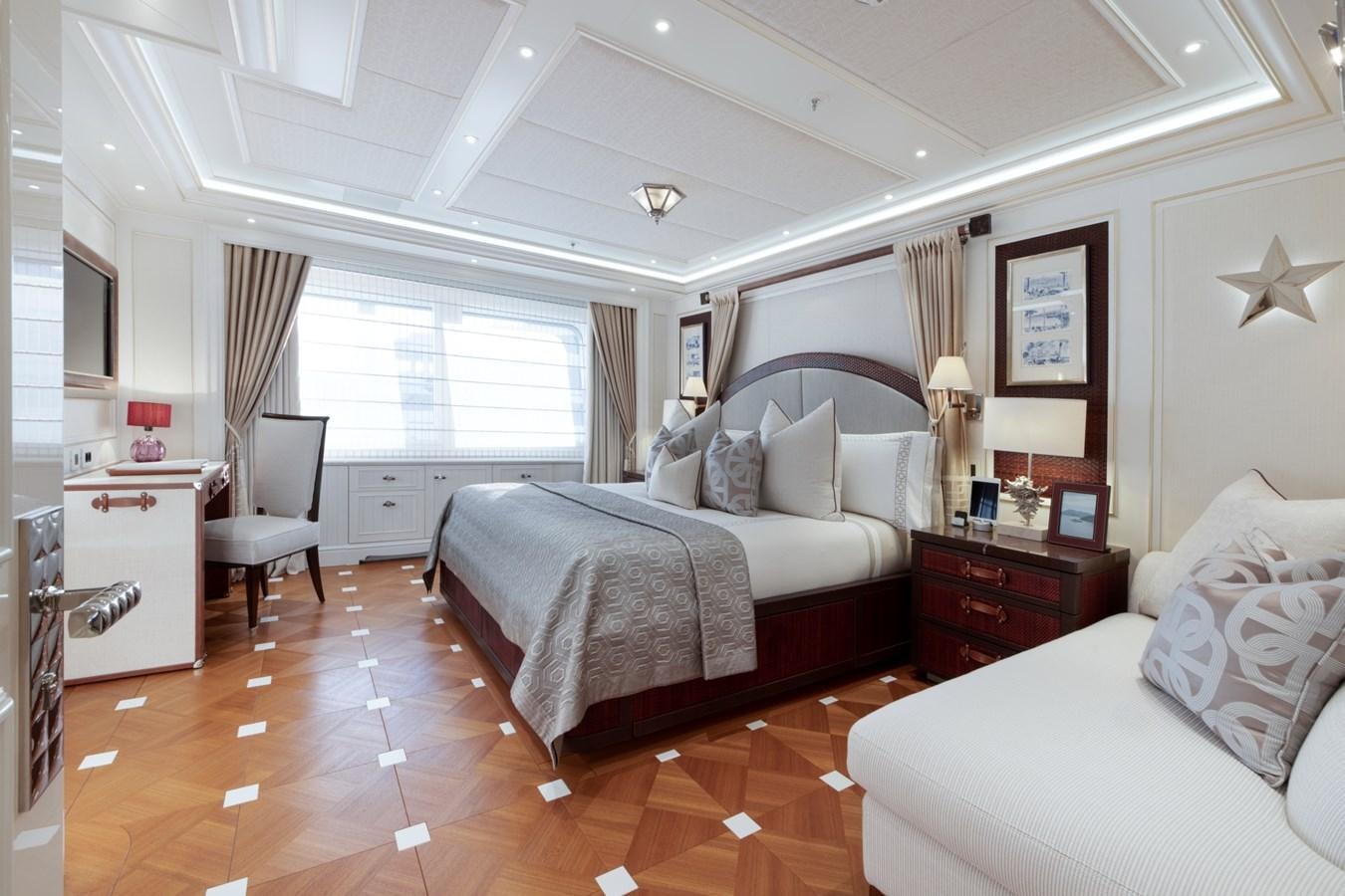 a bedroom with two beds aboard EYE Yacht for Sale