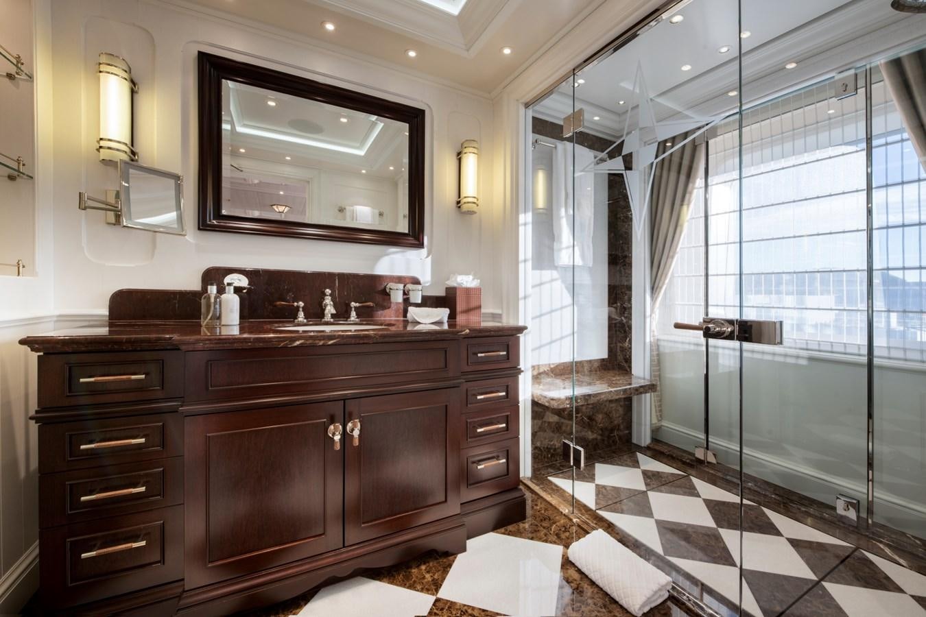 a bathroom with a large mirror aboard EYE Yacht for Sale