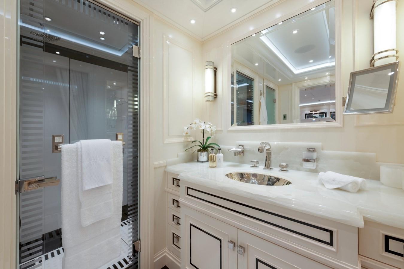 a bathroom with a sink and a mirror aboard EYE Yacht for Sale