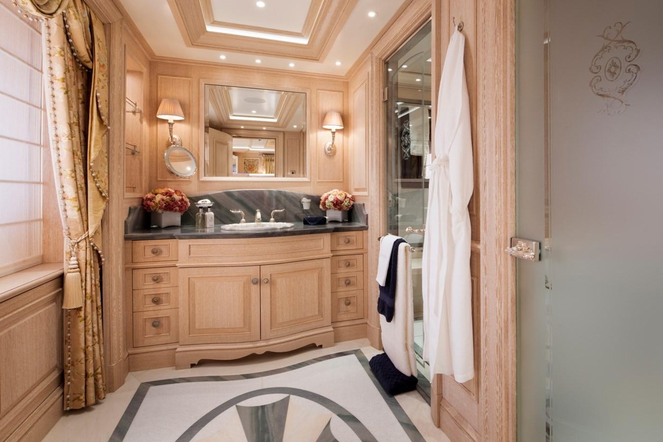 a bathroom with a sink and a mirror aboard EYE Yacht for Sale