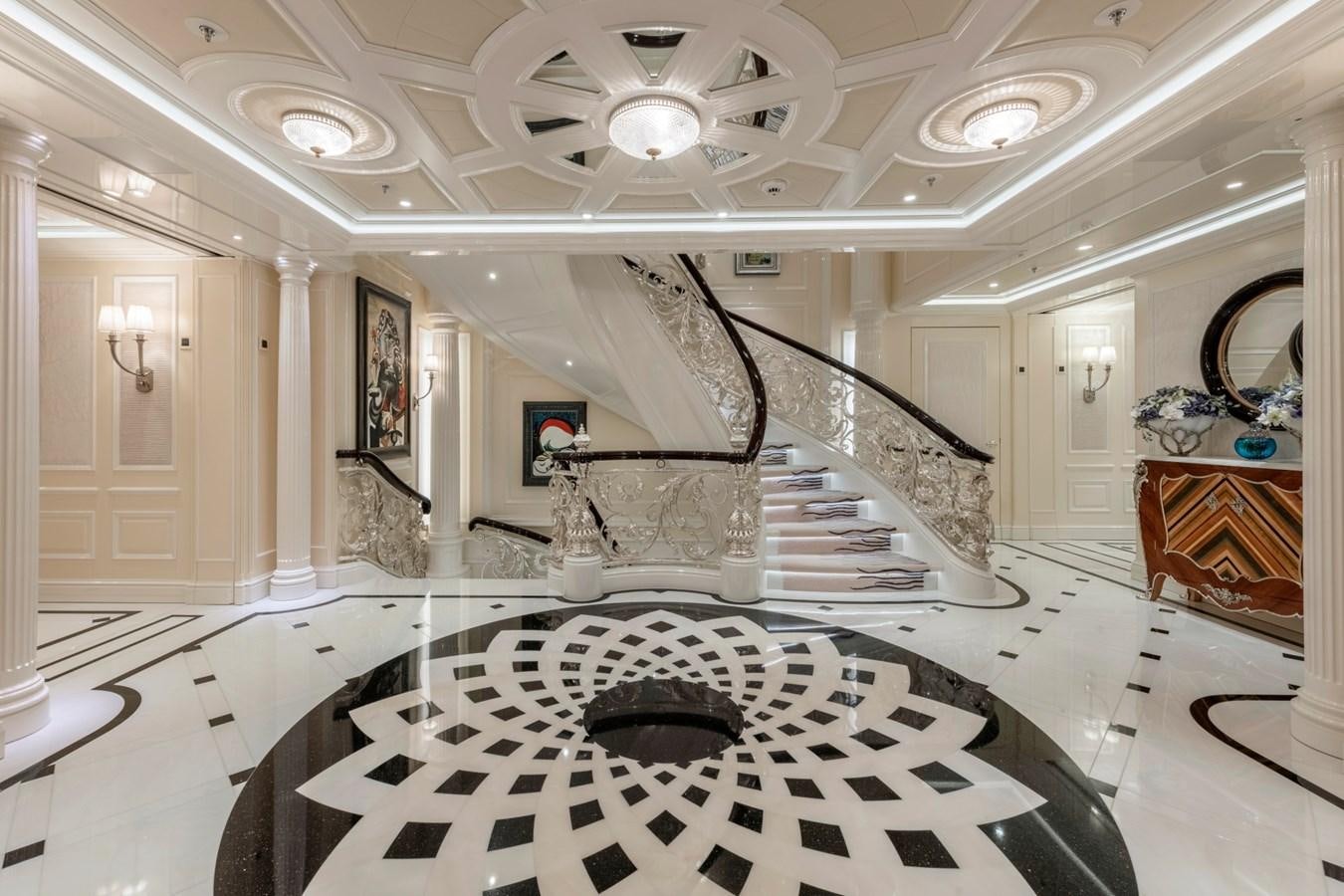 a large room with a staircase and a tile floor aboard EYE Yacht for Sale