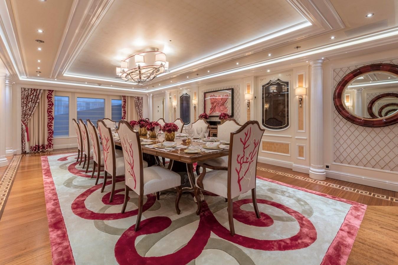 a dining room with a table and chairs aboard EYE Yacht for Sale