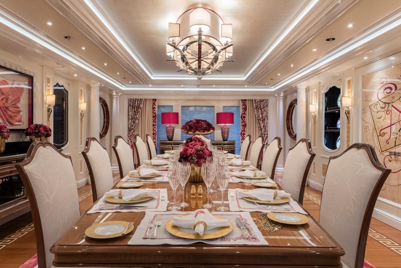 a dining room with a table set aboard EYE Yacht for Sale