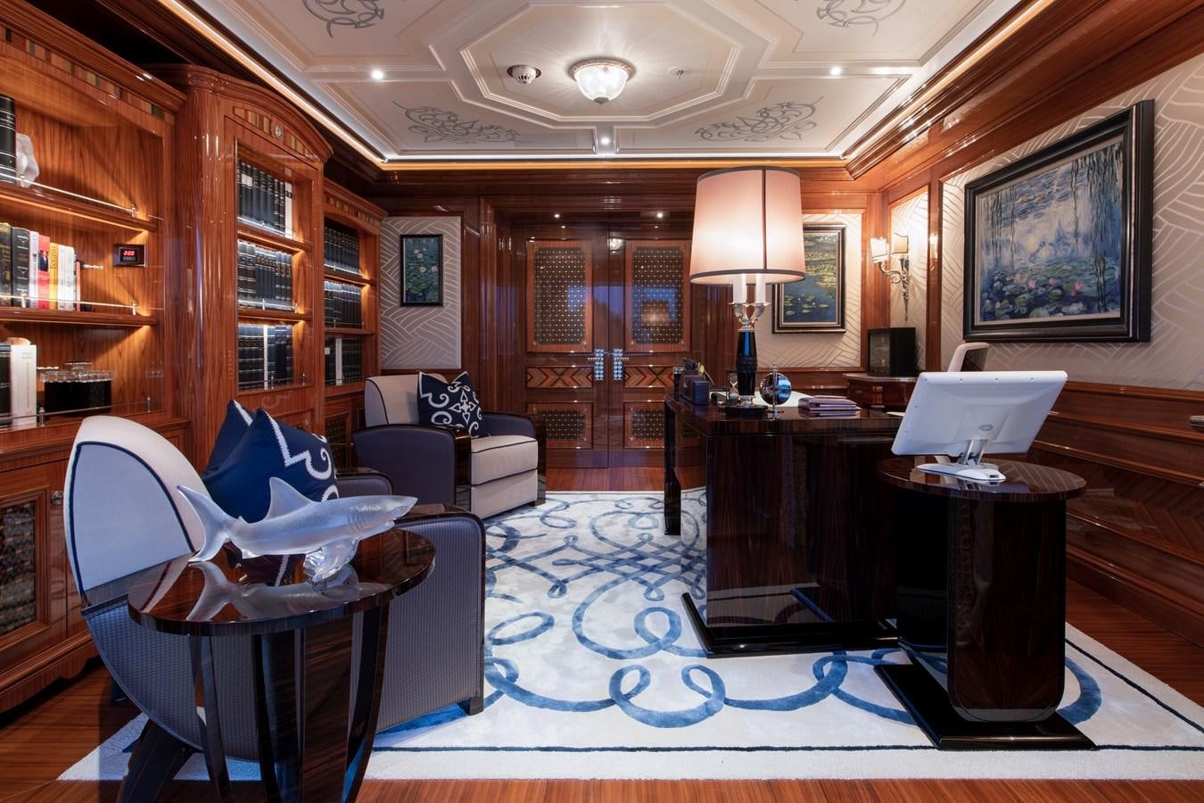 a room with a blue carpet and a blue rug aboard EYE Yacht for Sale