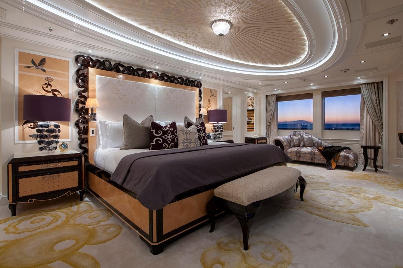 a large bed in a room aboard EYE Yacht for Sale