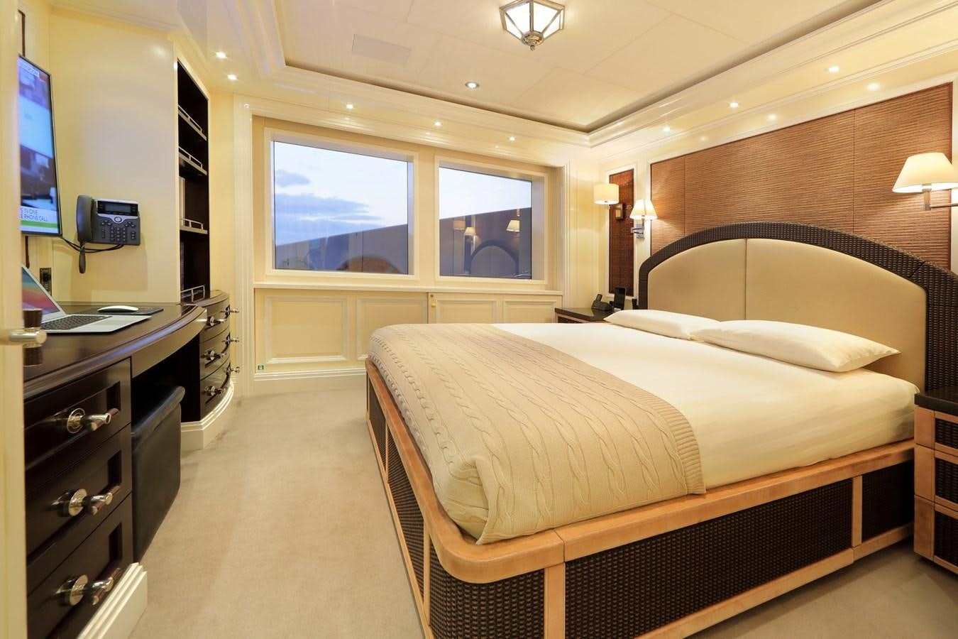 a bedroom with a bed and a tv aboard EYE Yacht for Sale