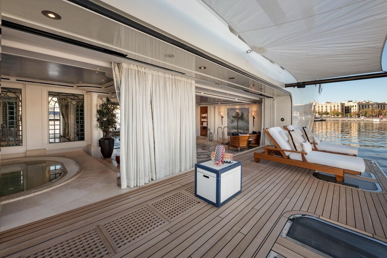 a large room with a large bed and a large window aboard EYE Yacht for Sale